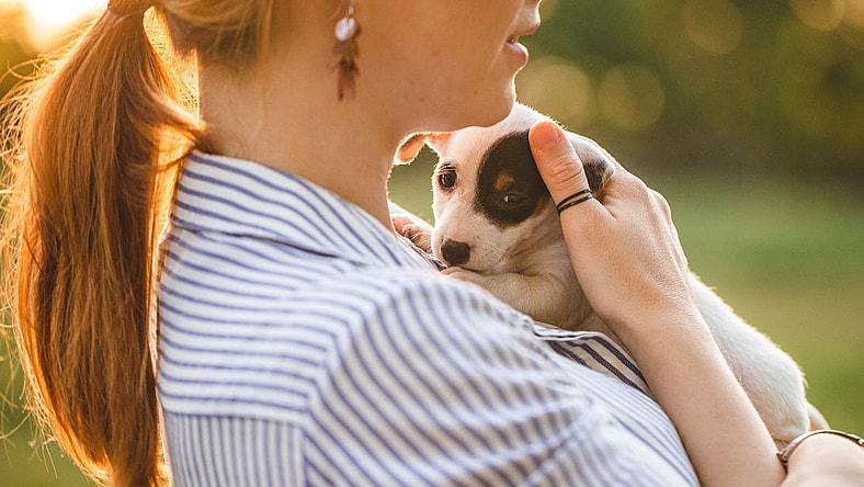 Woman with adopted puppy dog